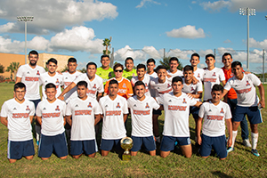 The Texas Southmost College Men’s Soccer Club pose with TSC Board Chairwoman Adela G. Garza (center) after defeating the University of Texas-San Antonio 6-0 at Scorpion Field Oct. 6, 2019 to win the Texas Collegiate Soccer League South Conference title and a berth in the NIRSA Region IV South Tournament.